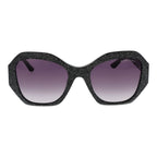 Black plastic sunglasses by Marciano by Guess with rounded frames and dark tinted lenses, stylish and trendy eyewear.