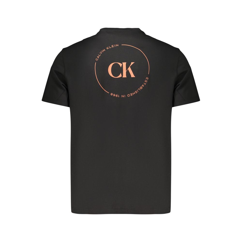 Calvin Klein black cotton men's T-shirt displayed flat, showcasing its simple design and soft fabric texture.