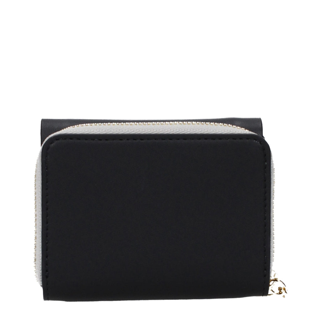 Black leather wallet by Stella McCartney with multiple card slots and sleek design, featuring subtle branding and stitched edges.