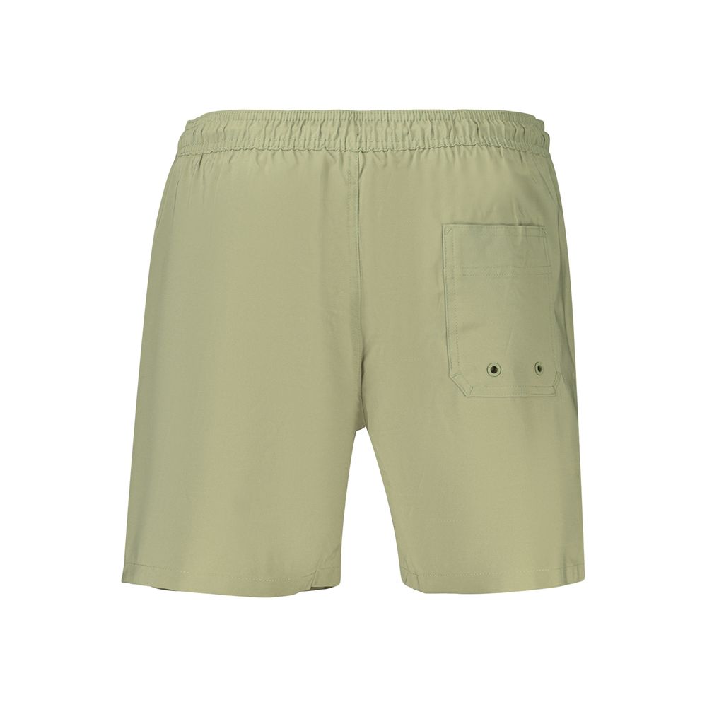 Calvin Klein green polyester men's swim shorts with elastic waistband and side pockets, suitable for beach or pool activities.