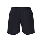 Tommy Hilfiger men's blue polyester swimwear with logo waistband, showcasing a stylish, fitted swim brief on a plain background.