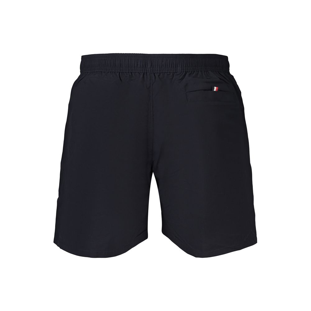 Tommy Hilfiger men's blue polyester swimwear with logo waistband, showcasing a stylish, fitted swim brief on a plain background.