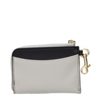 Stella McCartney black leather wallet with sleek design and subtle branding, featuring multiple card slots and a zip coin pocket.