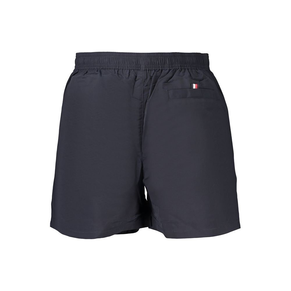 Tommy Hilfiger blue polyester men's swimwear with logo waistband and sporty design, suitable for swimming and beachwear.