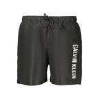 Calvin Klein men's black polyester shorts with an elastic waistband and side pockets, casual and comfortable for everyday wear.