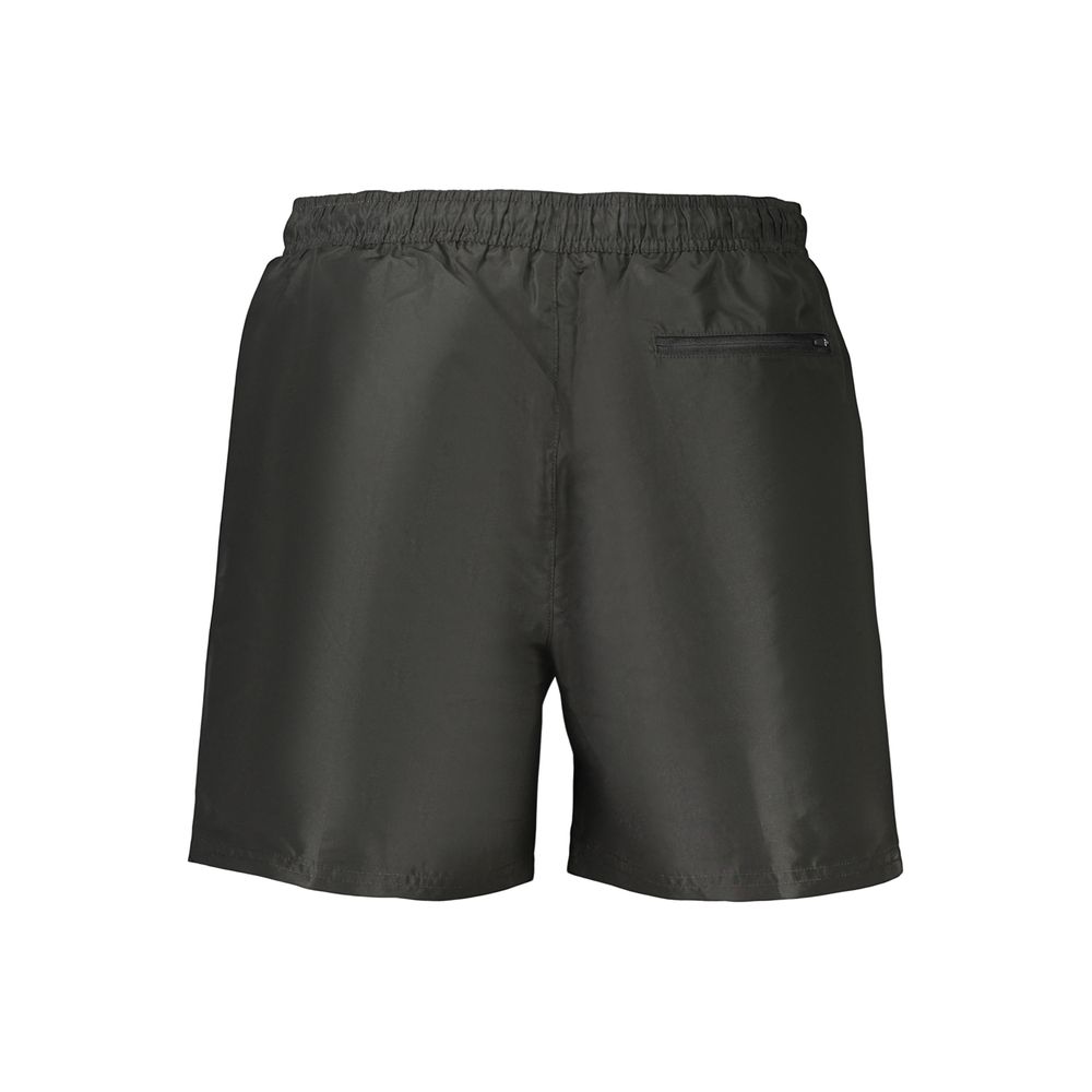 Calvin Klein black polyester men's shorts with a relaxed fit and elastic waistband, suitable for casual wear.