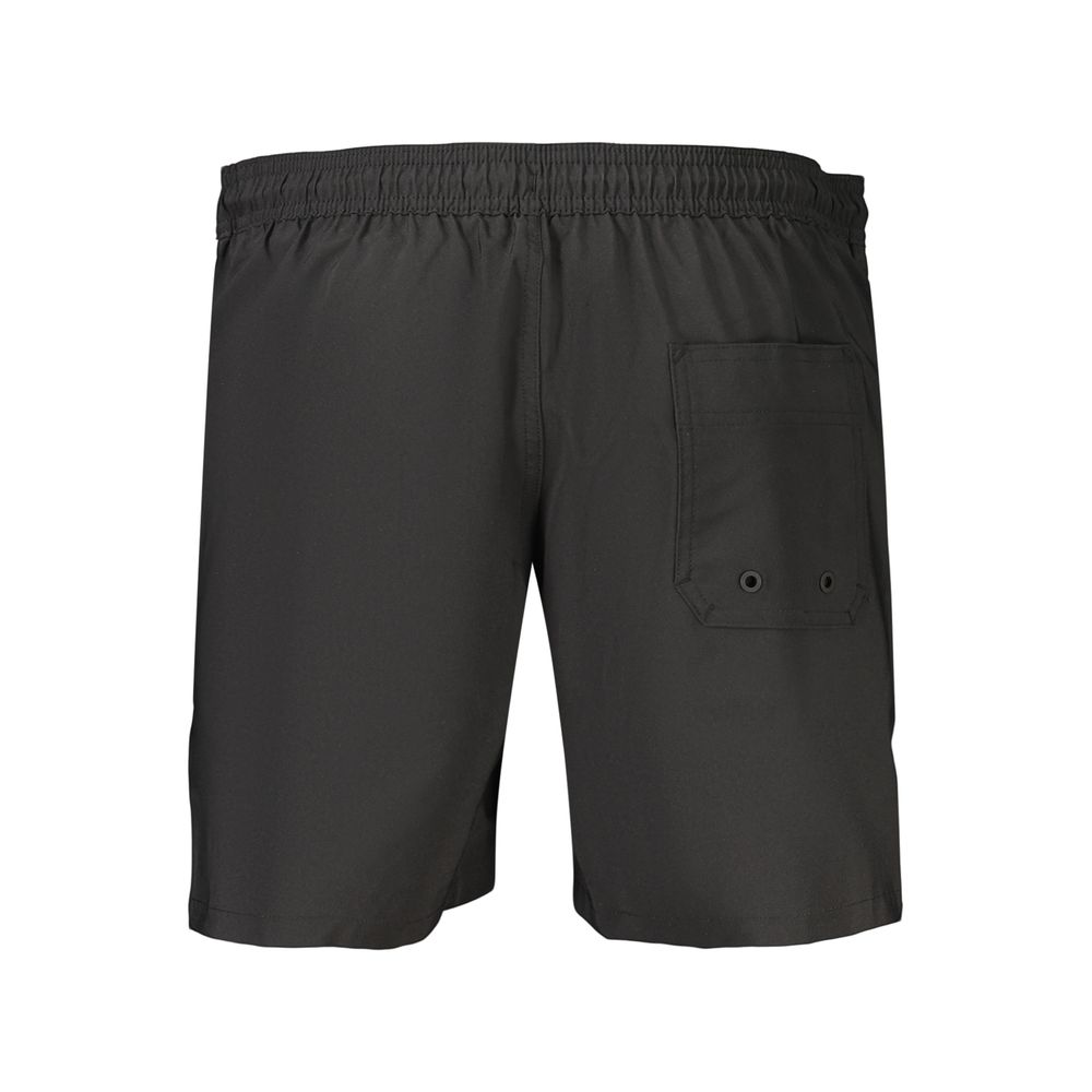 Calvin Klein Nero polyester men's boxer shorts with a sleek black design and comfortable fit, shown on a model.