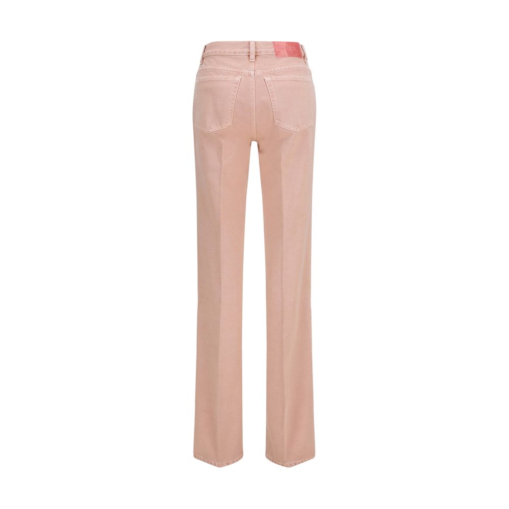 Chloé multicolor cotton straight-leg jeans with vibrant patchwork and classic five-pocket design, displayed on a hanger.