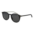 Polaroid black polycarbonate sunglasses with sleek frame and tinted lenses, stylish eyewear for sun protection.