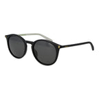 Polaroid black polycarbonate sunglasses with sleek frame and tinted lenses, stylish eyewear for sun protection.