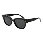 Polaroid black plastic sunglasses with sleek frame and tinted lenses, stylish eyewear for sun protection and fashion.