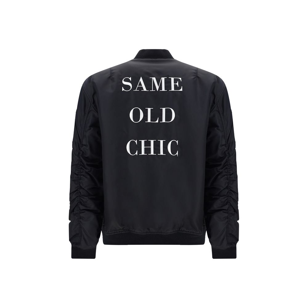 Moschino black polyamide bomber jacket with front zipper, ribbed cuffs and collar, stylish and lightweight outerwear.