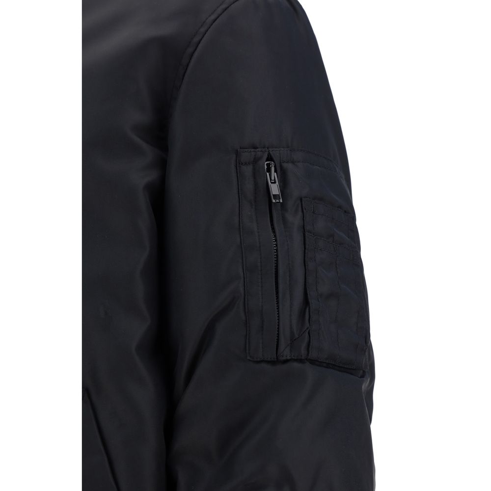 Black Moschino polyamide bomber jacket with a sleek design and subtle branding, shown on a plain background.