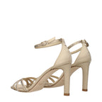 Jimmy Choo beige satin stiletto heel sandals with open toe and ankle strap, elegant footwear for formal occasions.