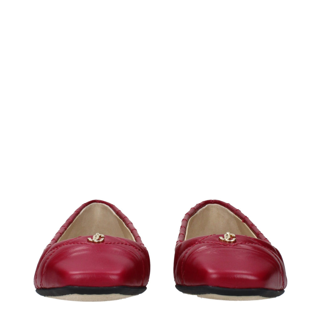 Jimmy Choo pink leather ballet flats with rounded toes and sleek design, perfect for stylish and comfortable everyday wear.