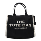 Black fabric shoulder bag by Marc Jacobs with adjustable strap and minimalist design, perfect for everyday wear.