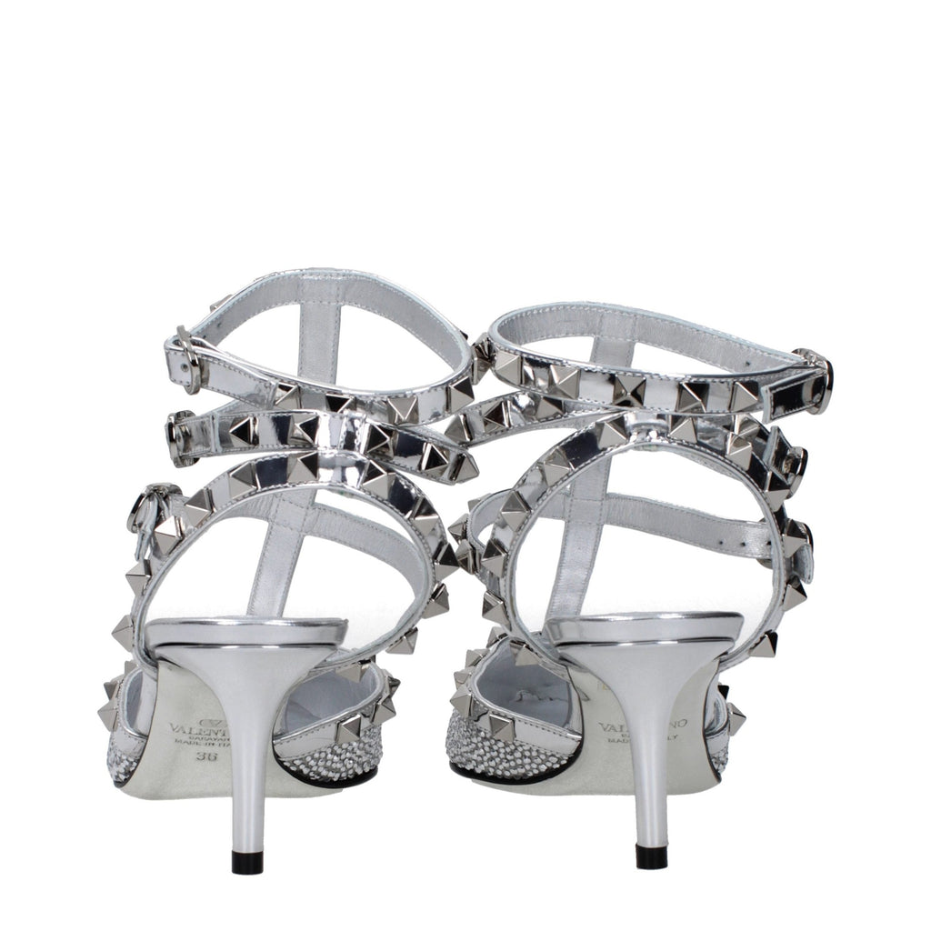 Valentino Garavani gray leather stiletto heel sandals with ankle straps and open toe design.