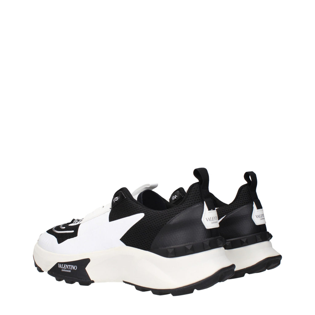 Valentino Garavani black fabric athletic sneakers with sleek design and white sole, ideal for casual and active wear.