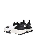 Valentino Garavani black fabric athletic sneakers with sleek design and white sole, ideal for casual and active wear.