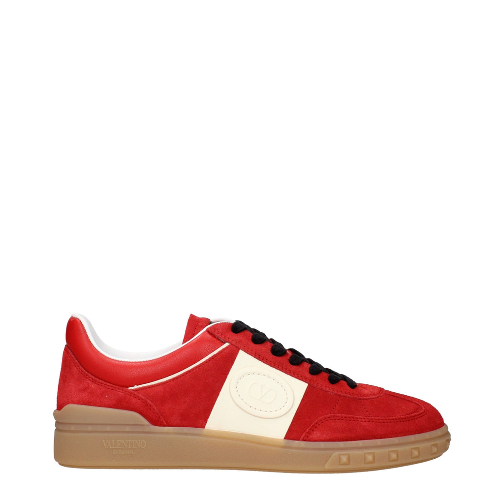 Red leather Valentino Garavani low top sneakers with sleek design and white rubber soles, perfect for casual style.