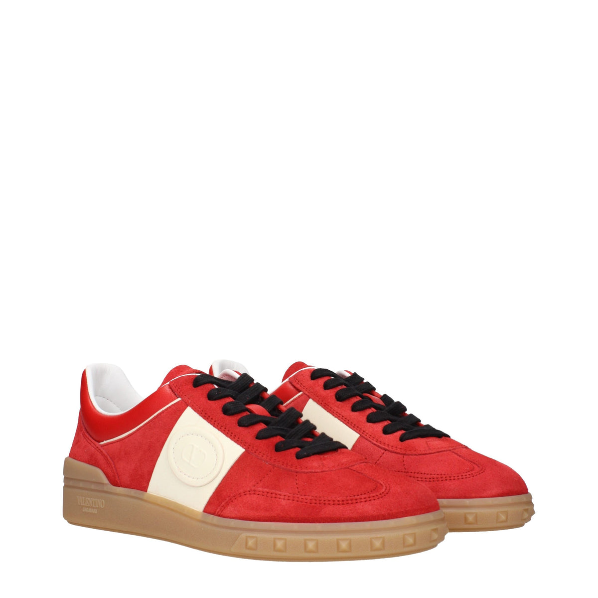 Red leather Valentino Garavani low top sneakers with white soles and subtle branding, casual footwear for stylish everyday wear.