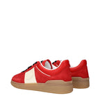 Valentino Garavani red leather low top sneakers with white soles and sleek design, perfect for casual style.