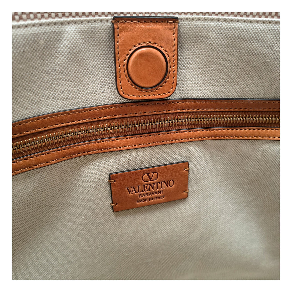 Beige Valentino Garavani fabric handbag with top handles and subtle logo details, stylish and elegant for everyday use.