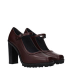 Max Mara brown leather high heel pumps with sleek pointed toes and stiletto heels, stylish and elegant for formal occasions.