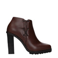 Max Mara brown leather ankle boots with rounded toes and low block heels, stylish and versatile for everyday wear.