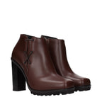Max Mara brown leather ankle boots with sleek design and low heel, perfect for stylish casual or office wear.