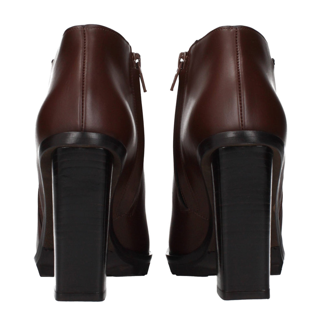 Max Mara brown leather ankle boots with sleek design and low heel, stylish footwear for casual or chic outfits.