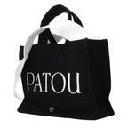 Patou black cotton handbag with sleek design and shoulder strap, stylish accessory for everyday use.