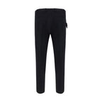 Black PT Pantaloni TORINO dress pants with elastane, slim-fit style, shown on a hanger against a white background.