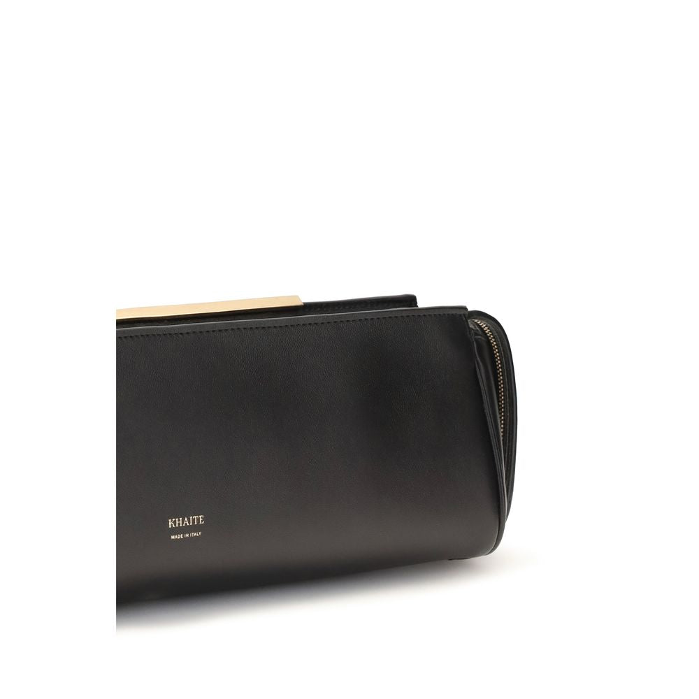 Khaite black calf leather Bos Taurus clutch bag with sleek design and minimalist style, featuring a textured leather surface.