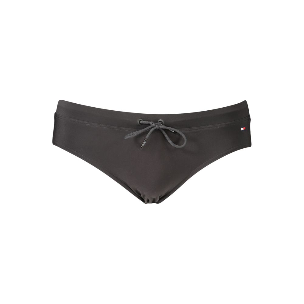 Black polyester men's briefs by Tommy Hilfiger with the iconic logo waistband, designed for comfort and everyday wear.