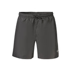 Calvin Klein black polyester men's swimwear with elastic waistband and side logo, suitable for swimming and beachwear.