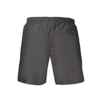 Black Calvin Klein men's swimwear made of polyester, featuring a sleek design and comfortable fit for beach or pool.
