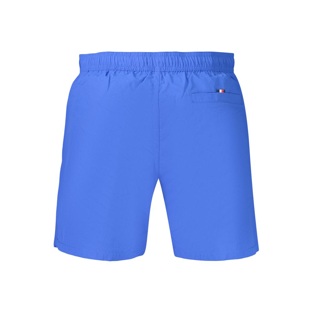 Tommy Hilfiger men's blue polyester shorts with elastic waistband and side pockets, casual summer apparel.