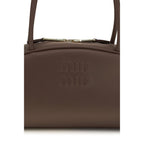 Miu Miu brown calf leather Bos Taurus shoulder bag with gold-tone hardware and adjustable strap.
