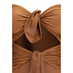 Zimmermann beige polyamide one-piece swimsuit displayed on a mannequin with a plunging neckline and sleek design.