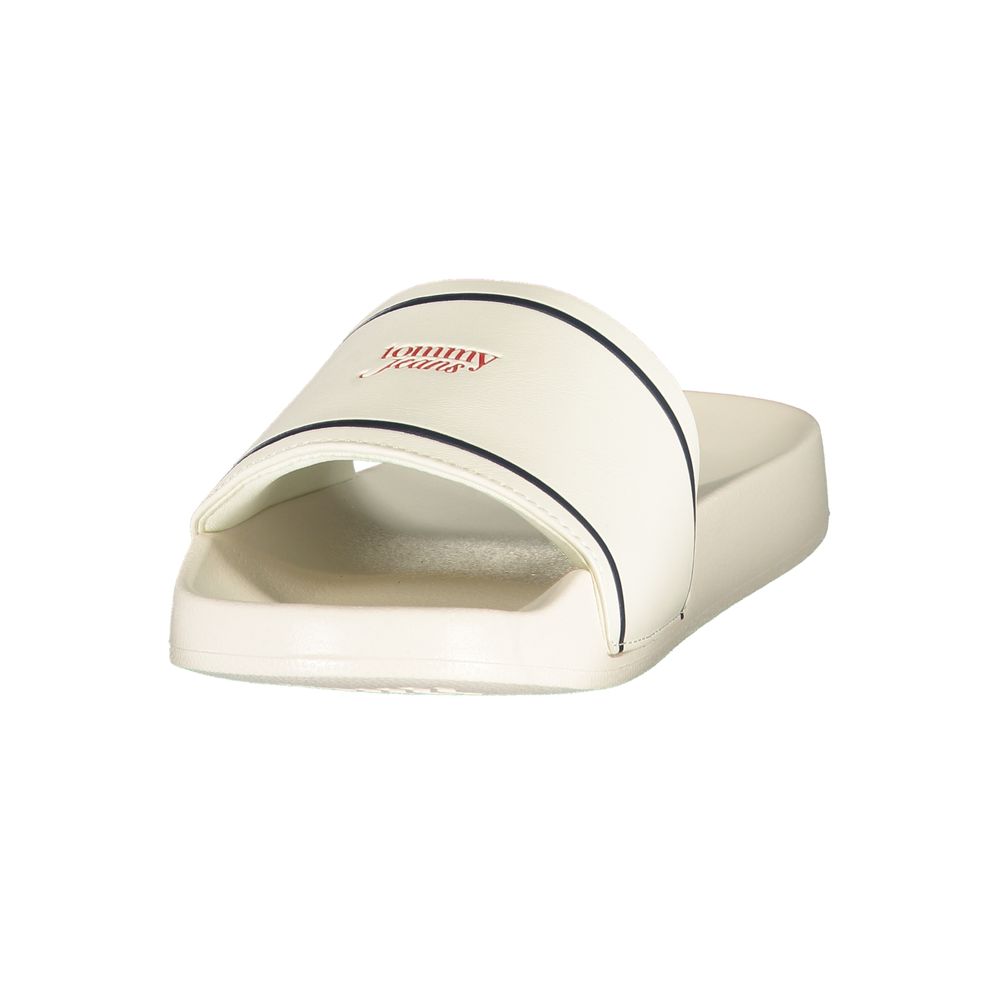 White Tommy Hilfiger women's polyurethane slipper with a comfortable slip-on design and subtle branding.