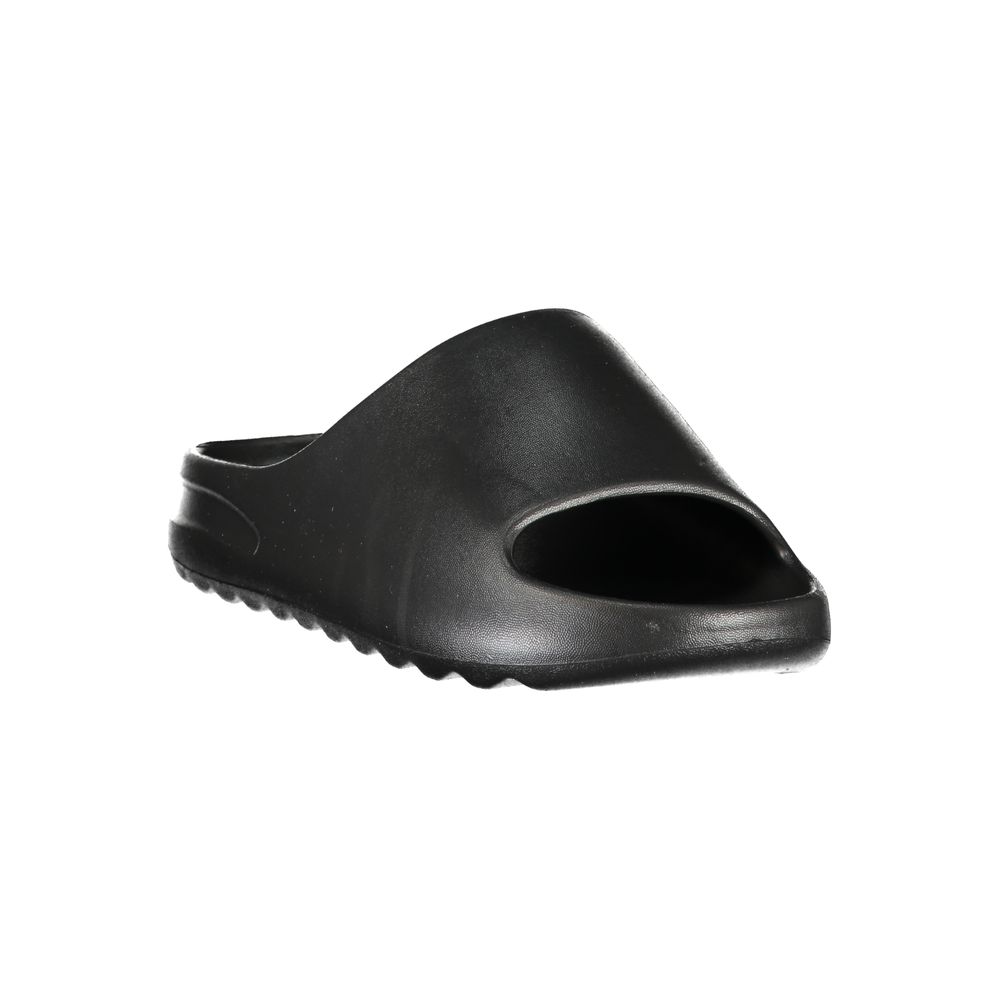 Norway 1963 black polyurethane women's slippers with a comfortable slip-on design and soft interior.