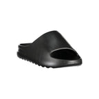 Norway 1963 black polyurethane women's slippers with a comfortable slip-on design and soft interior.