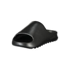 Norway 1963 black polyurethane women's slippers with open toe design and slip-on style, ideal for casual indoor wear.