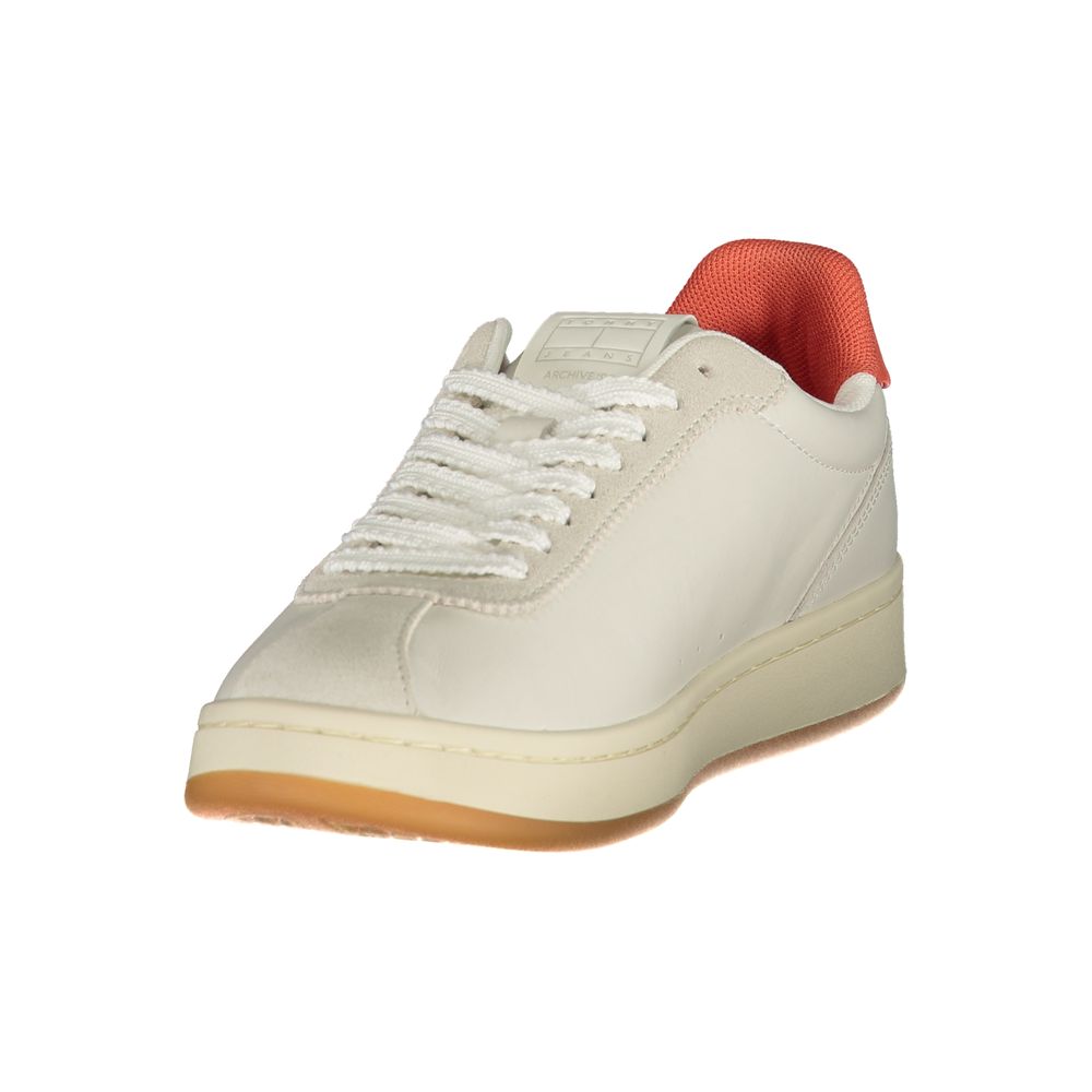 Tommy Hilfiger beige polyurethane women's sneaker with white sole and lace-up design on a neutral background.