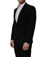 Black wool Dolce & Gabbana men's single-breasted blazer jacket with notch lapel and tailored fit.