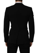 Black wool men's blazer jacket by Dolce & Gabbana with a single-breasted design and tailored fit.
