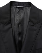 Dark blue wool Dolce & Gabbana men's single-breasted blazer jacket with notch lapel and buttons, tailored fit for a refined look.
