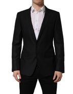 Dark blue wool Dolce & Gabbana men's single-breasted blazer jacket with notch lapels and tailored fit.
