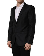 Dark blue wool Dolce & Gabbana men's single-breasted blazer jacket with notch lapels and tailored fit.